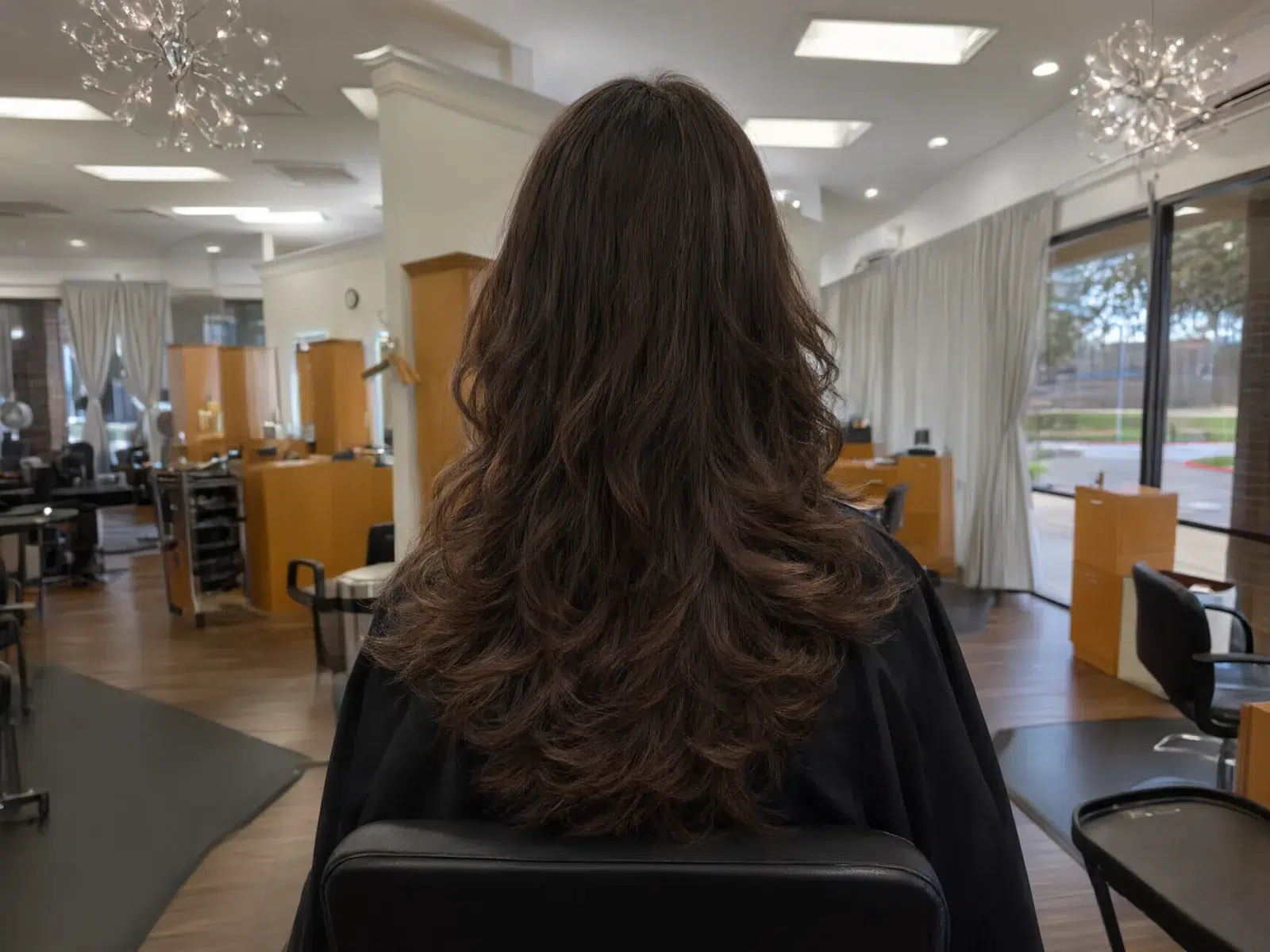 Bouncy, glossy blowout with movement in the ends at Salon D in Dallas