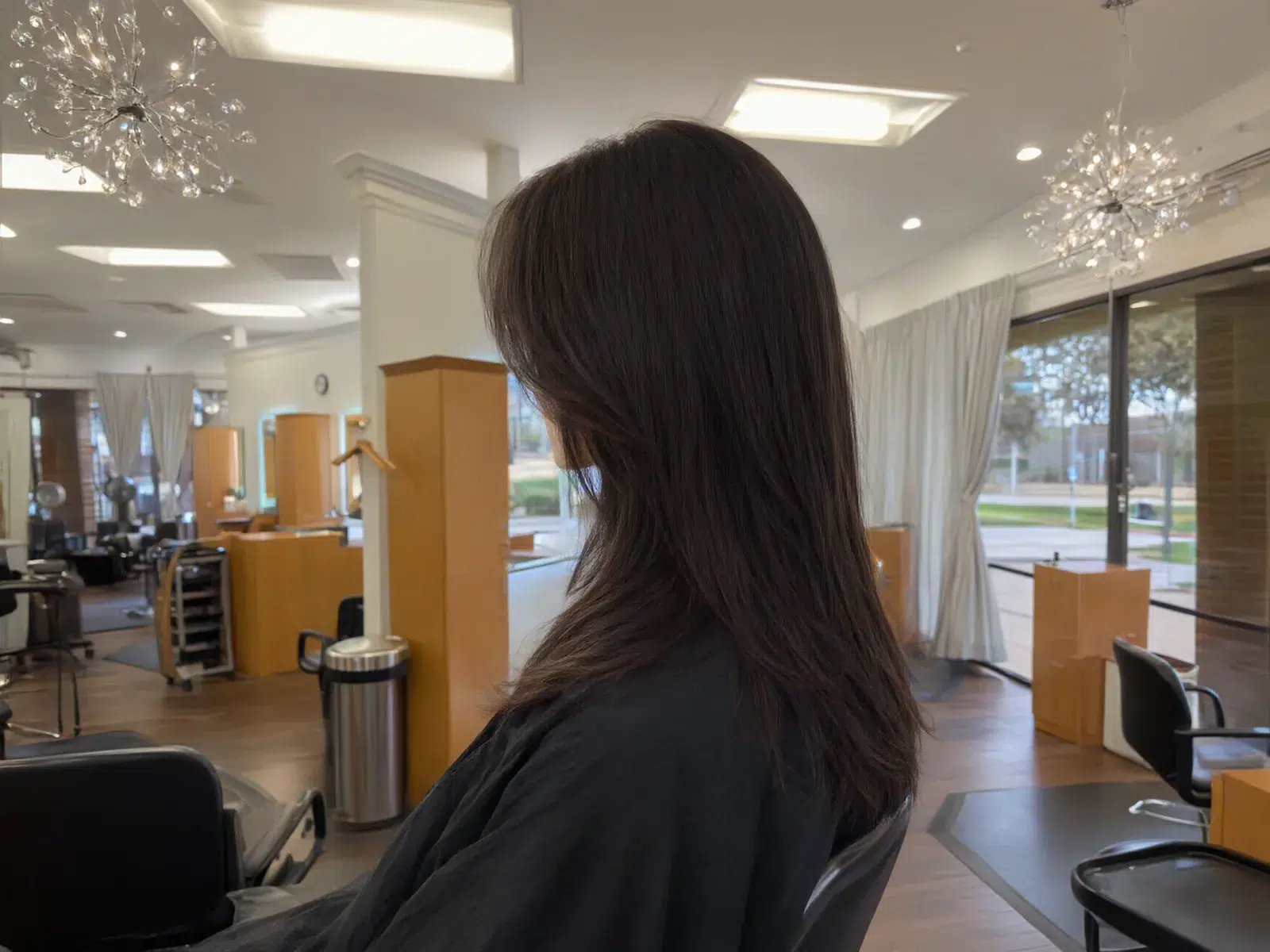 Dark brunette hair with face-framing layers, straight, Salon D Dallas