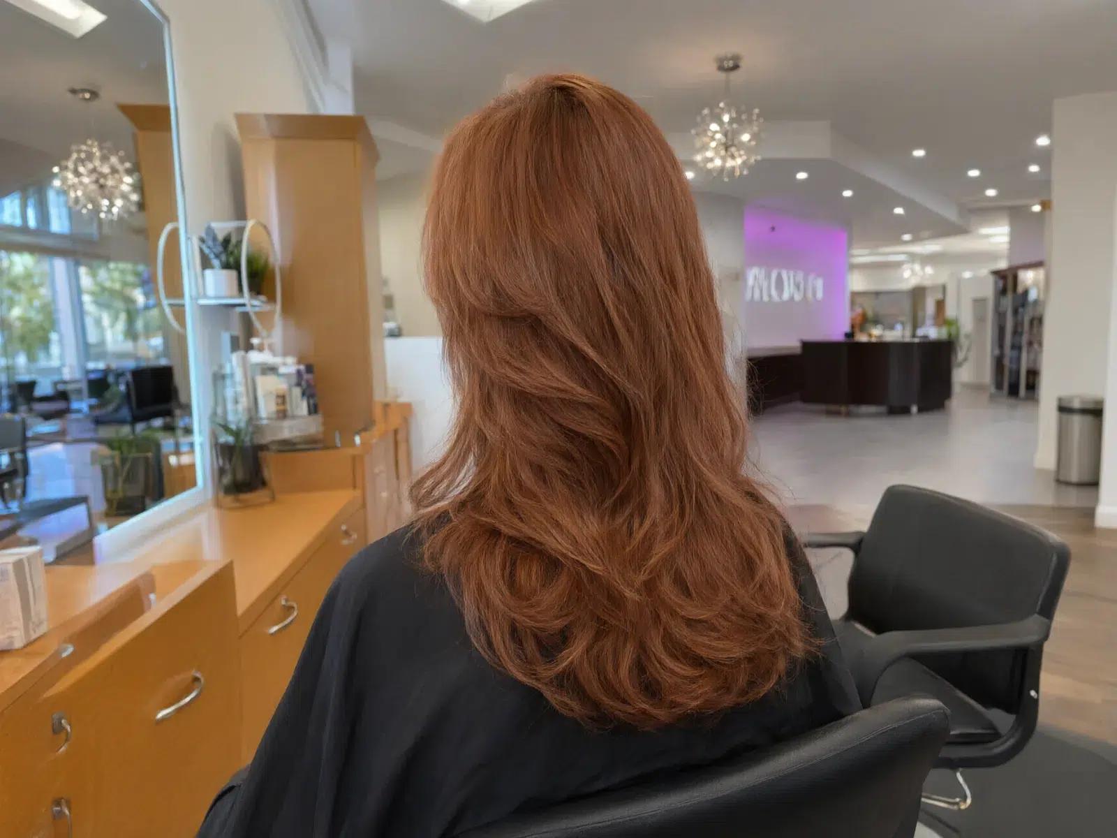 Long, full hair extensions blended seamlessly, soft waves at Salon D in Dallas