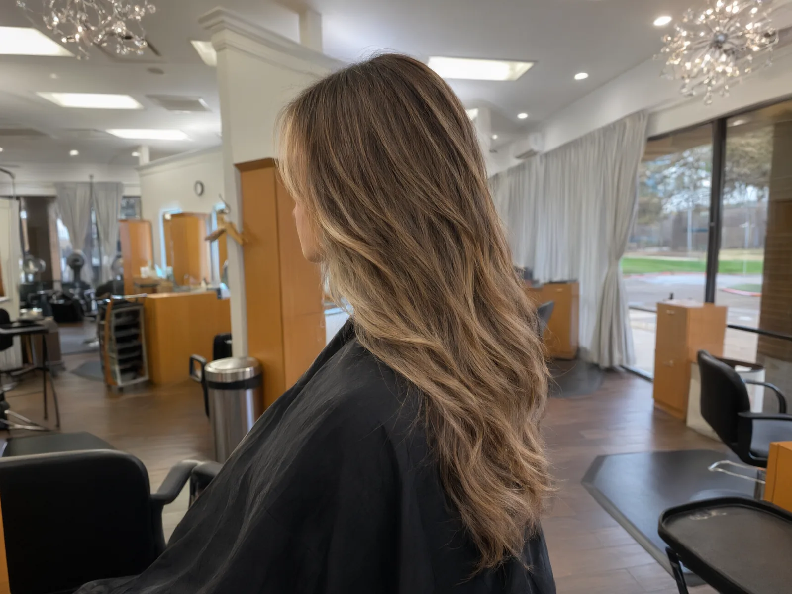 Soft hand-painted balayage in honey and caramel tones, blended at the roots, Salon D Dallas
