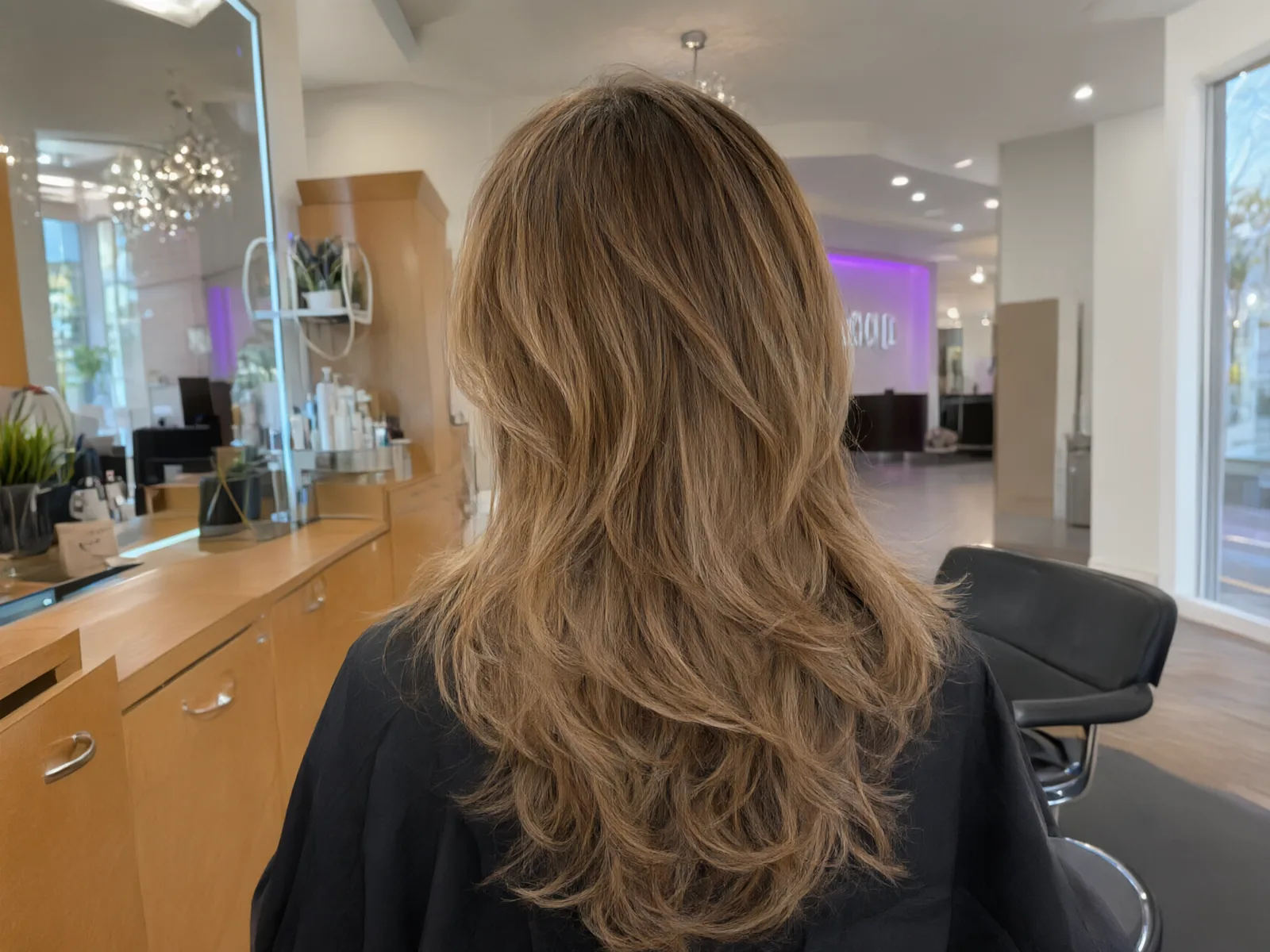 Soft hand-painted balayage in honey and caramel tones, blended at the roots at Salon D in Dallas