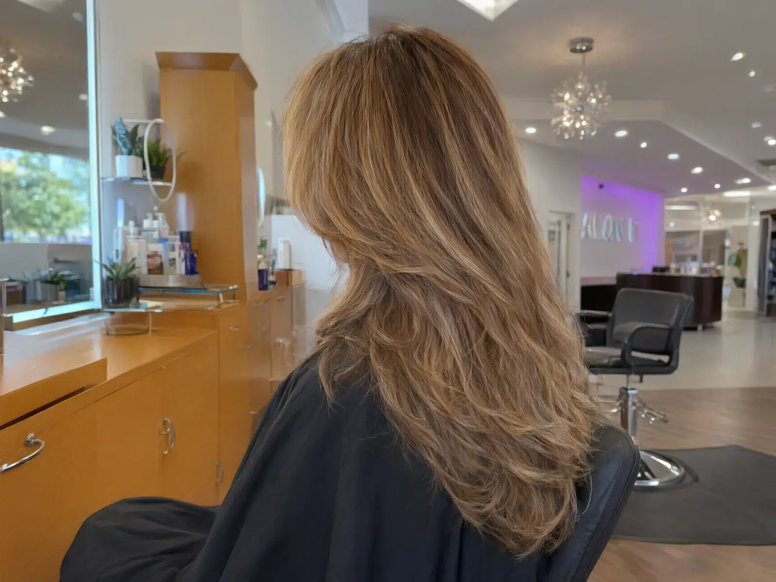 Soft hand-painted balayage in honey and caramel tones, blended at the roots, Salon D Dallas